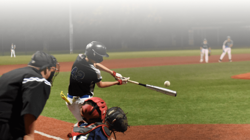 LukasHam29 hits the baseball to the outfield