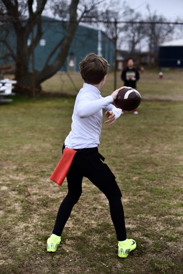 SpeedyPetey throwing the football with the microfiber performance sports towel in his waistband