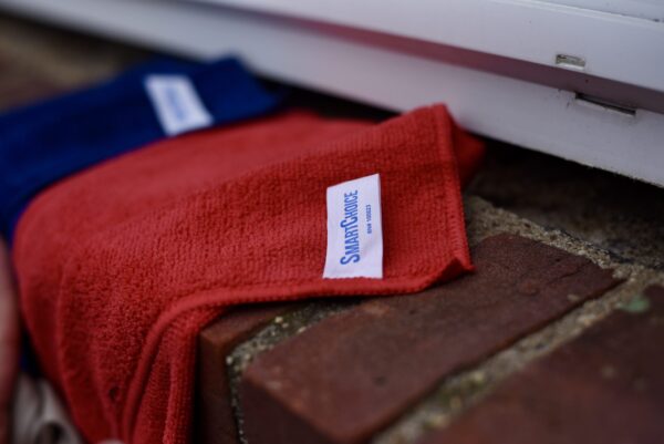 Blue and Red Performance Sports Towel showing closeup of fabric tag "Smart Choice"