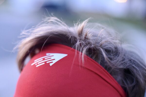 Speedy performance sports headband in red with white icon (closeup)