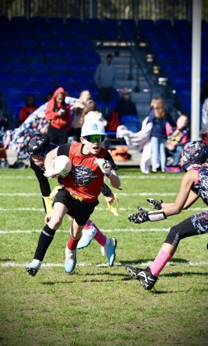 SpeedyPetey52 running the ball at the Disney Flag Football Championships in 2024