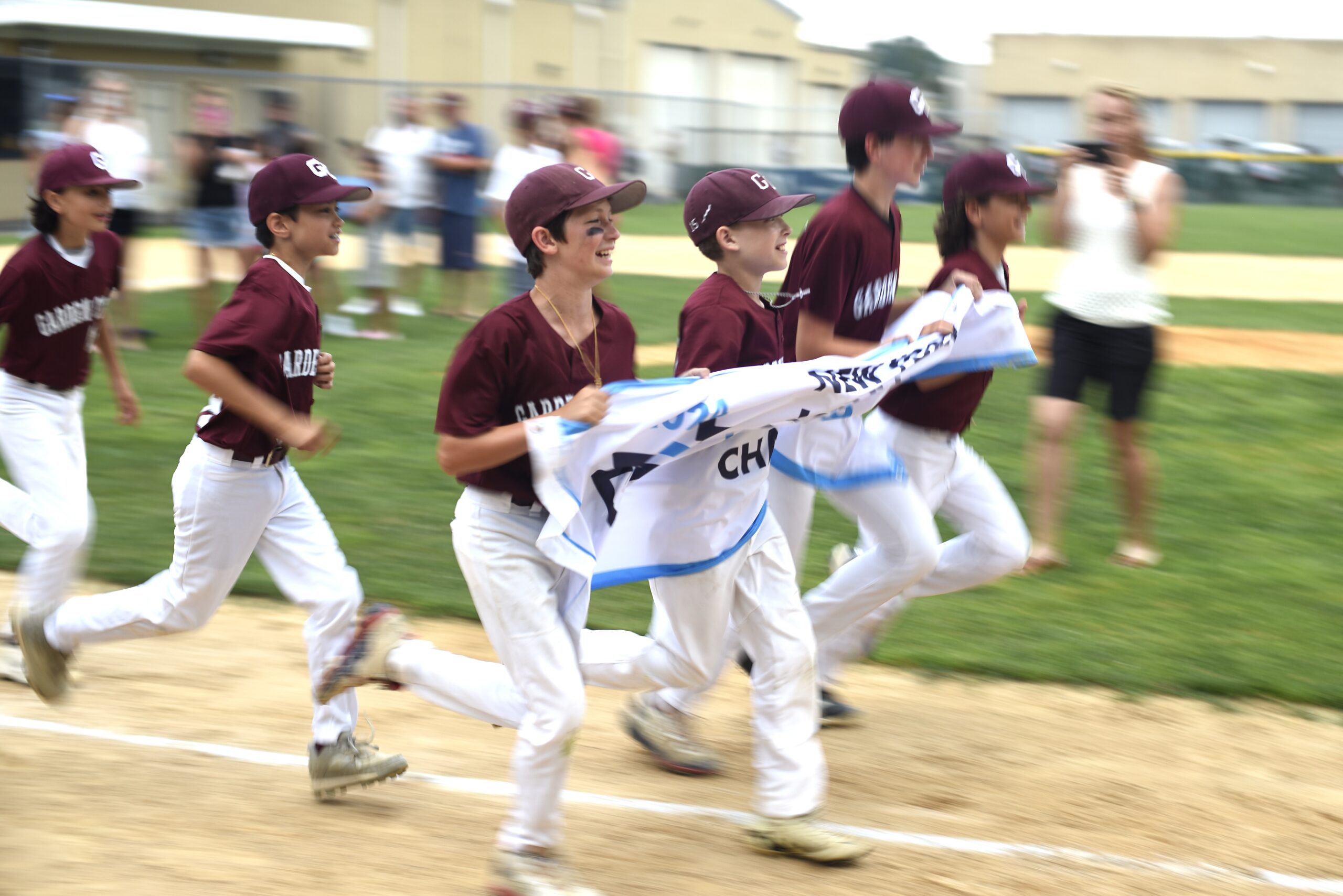 District baseball team celebrates with championship banner
