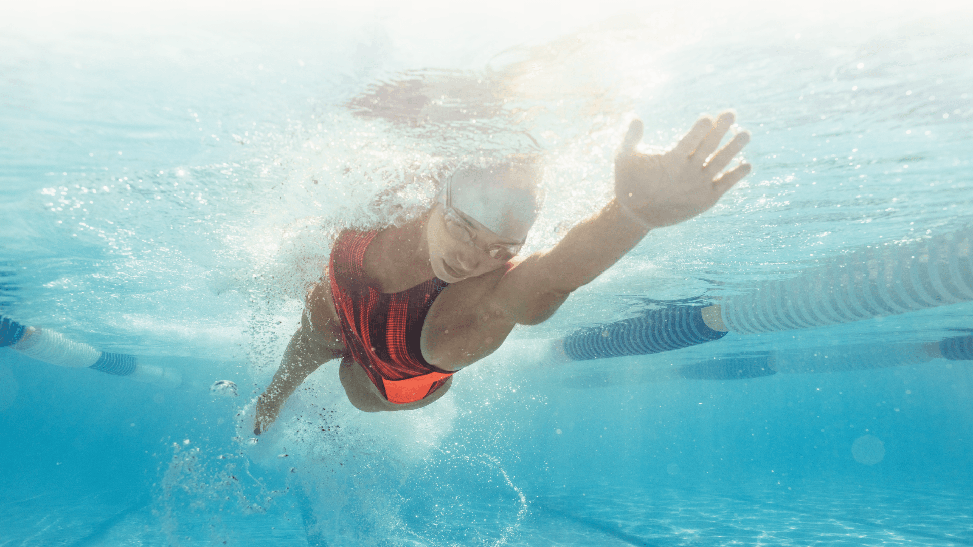 Swimmer underwater in pool